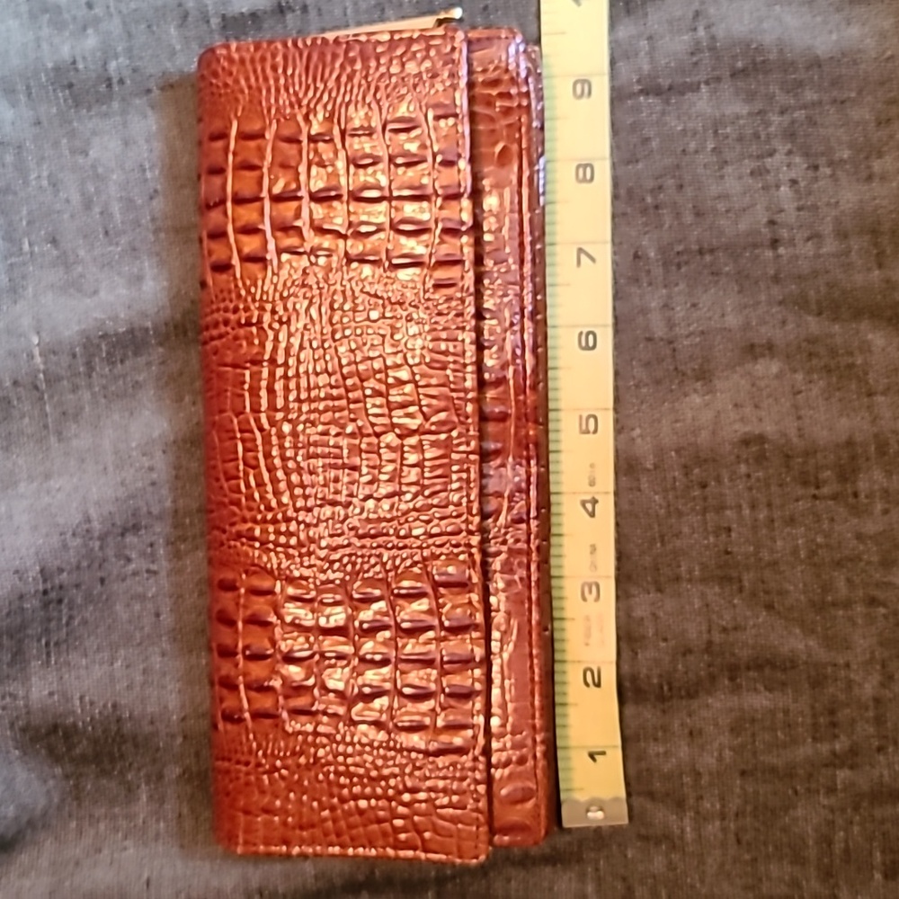 100% Genuine crocodile skin clutch. Vintage with brass detailing.